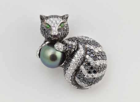 White Gold Cat Brooch with Black and Colorless Diamonds, Tsavorite Garnets, and a Tahitian Pearl