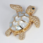 Yellow Gold Sea Turtle Brooch with Diamonds, Blue Sapphires, and Mother of Pearl