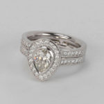 Platinum Pear Shape Diamond Ring with Diamond Shoulders and Attached Diamond Band