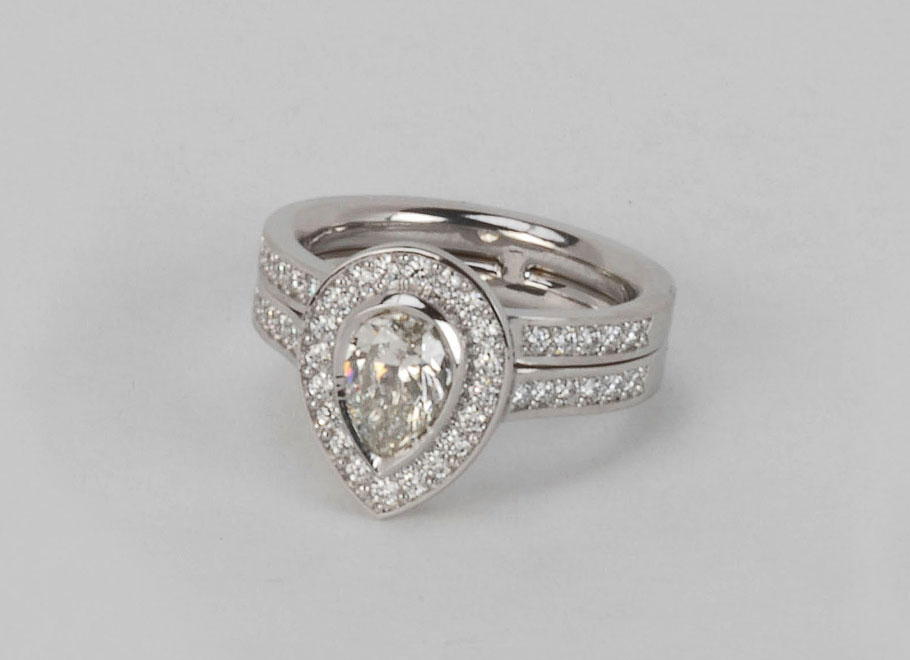 Platinum Pear Shape Diamond Ring with Diamond Shoulders and Attached Diamond Band