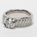 platinum engagement ring with diamond shoulders