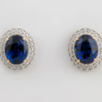 Prong set oval blue sapphires in 18 karat yellow gold