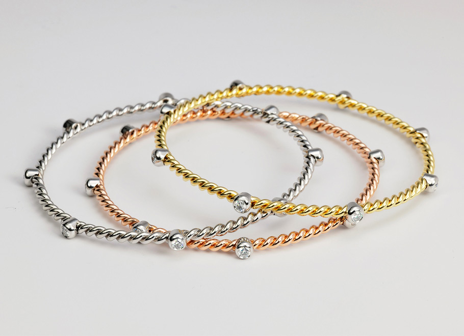 White, Rose, and Yellow Gold Bangles with Platinum Diamond Stations