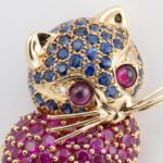 Kitten Brooch With Yellow Gold, Blue Sapphires, Rubies, Diamonds, and Garnets